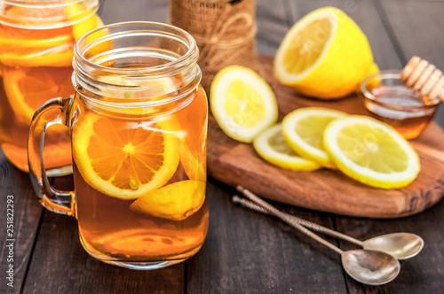 Hot tea with lemon and natural honey, good treat to have vitamins and strong immunity.