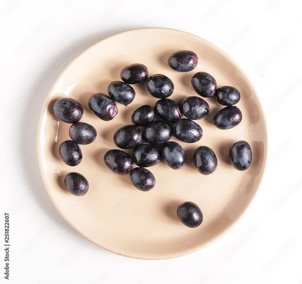 Black grapes on a plate. Black grapes on a plate.