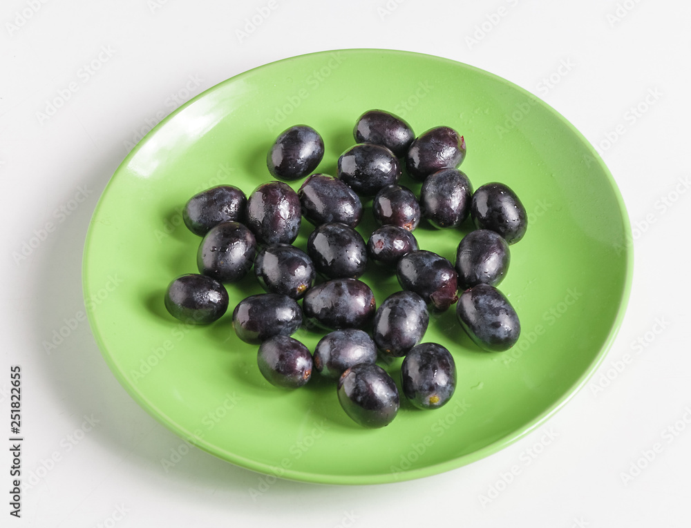 Black grapes on a plate. Black grapes on a plate.