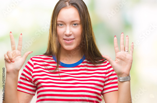 Young caucasian beautiful woman over isolated background showing and pointing up with fingers number eight while smiling confident and happy.