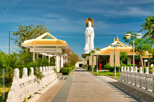 Long alley leading to the largest statue of the goddess Guanyin in Nanshan Park. Hainan. photo