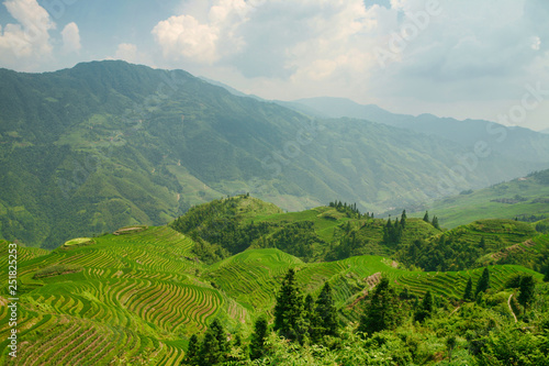  Beautiful view of Longjie’s emerald rice terraces and surrounding mountains.