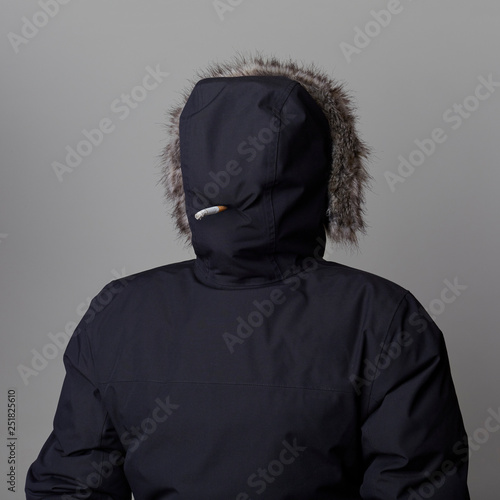 Man smoking in hood