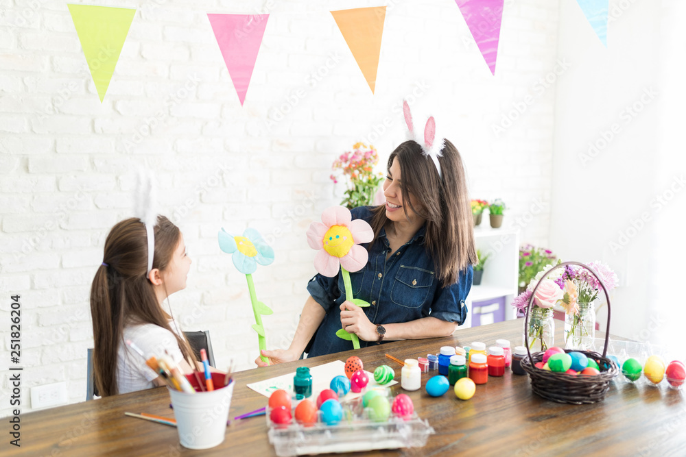 Mom Encouraging Girl To Create Artwork During Easter Mom Encouraging Girl To Create Artwork During Easter