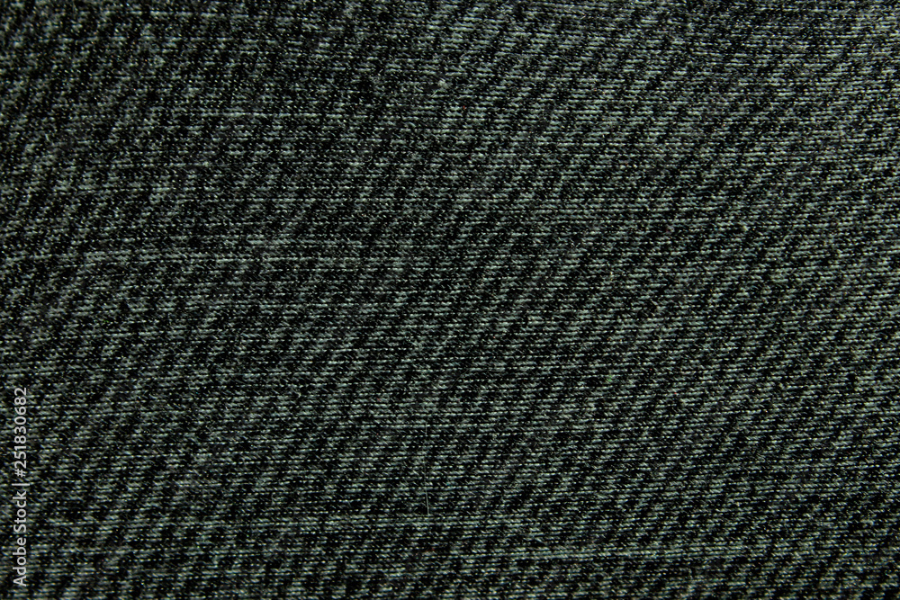Blurred Jeans Texture Background. Abstract Black Denim Background. Cropped Shot Of Gray Denim Jeans. Blurred Jeans Texture Background. Abstract Black Denim Background. Cropped Shot Of Gray Denim Jeans.