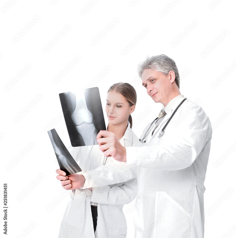 Woman doctor reviewing xrays with colleague.isolated on a white Woman doctor reviewing xrays with colleague.isolated on a white
