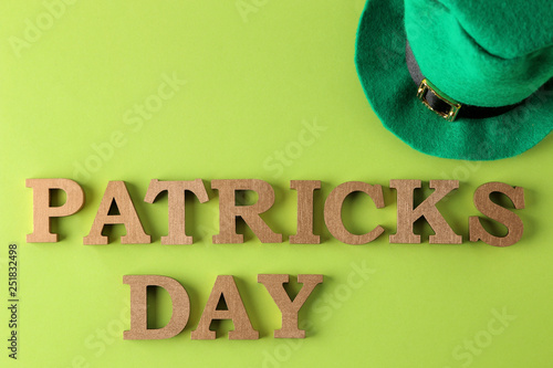St.Patrick 's Day. celebration. A green  leprechaun hat  and the text of March 17 on a bright green background. top view.