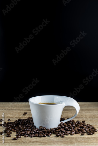 Coffee Cup and Coffee bean on wood table