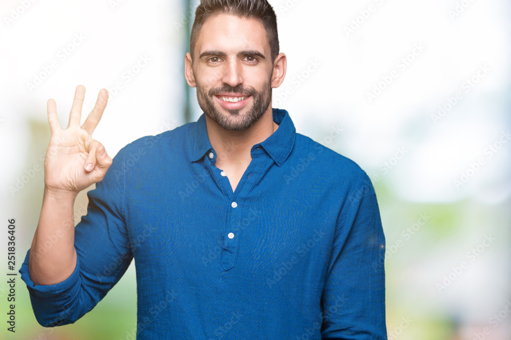 Young handsome man over isolated background showing and pointing up with fingers number three while smiling confident and happy. Young handsome man over isolated background showing and pointing up with fingers number three while smiling confident and happy.