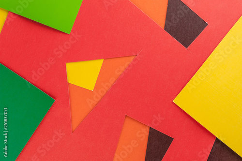 Multi-colored real vivid paper sheets texture background. Red  brown  yellow  orange  green.