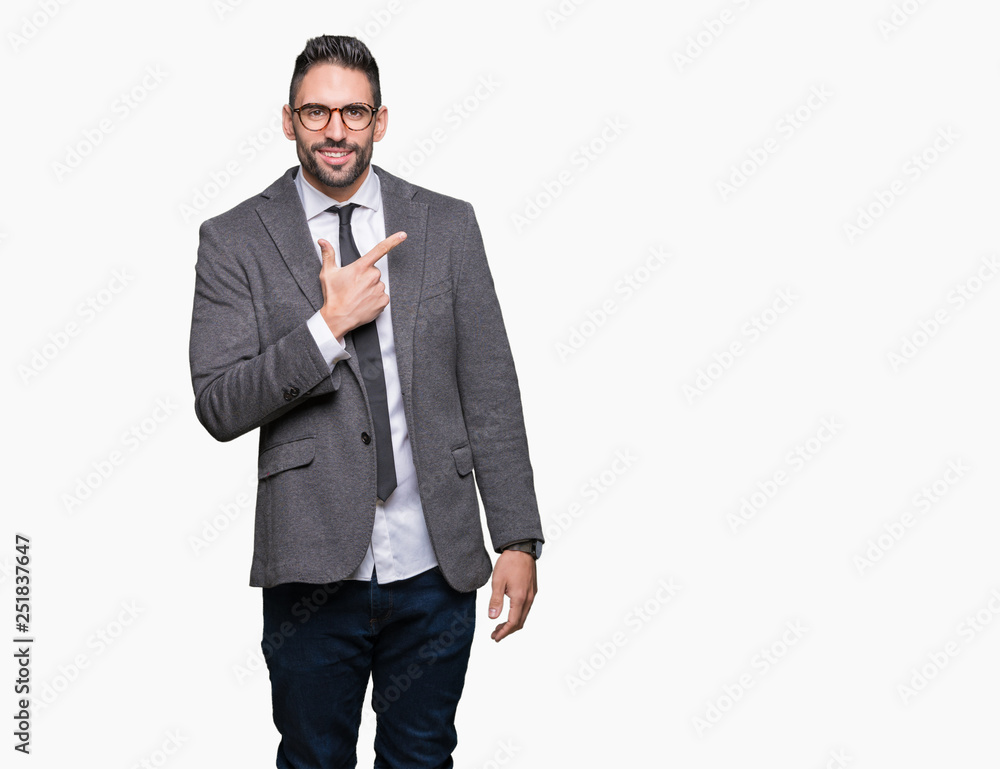 Young handsome business man over isolated background cheerful with a smile of face pointing with hand and finger up to the side with happy and natural expression on face Young handsome business man over isolated background cheerful with a smile of face pointing with hand and finger up to the side with happy and natural expression on face