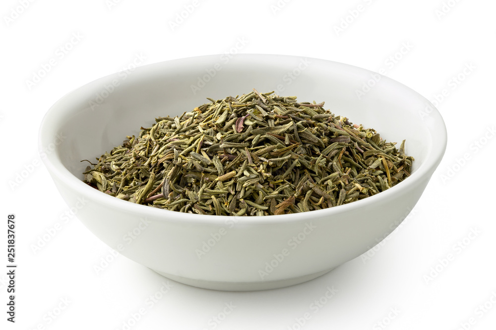 Dried rubbed thyme in a white ceramic bowl isolated on white. Dried rubbed thyme in a white ceramic bowl isolated on white.