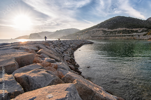 Photography Beach in calm rocky landscape at sunset
