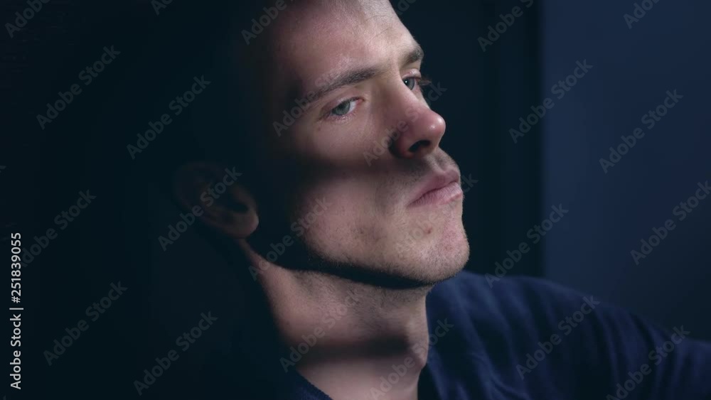 sad depressed young man thinking in the dark.Loneliness,depression,sadness sad depressed young man thinking in the dark.Loneliness,depression,sadness