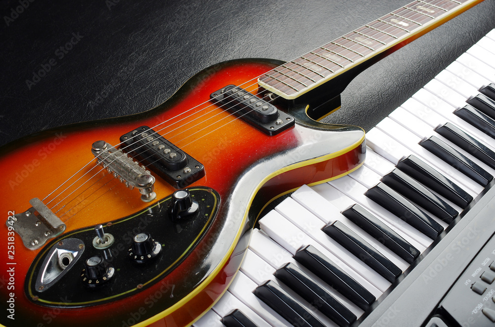 Værdiløs kobling Encommium Electric guitar and piano keyboard. Stock Photo | Adobe Stock