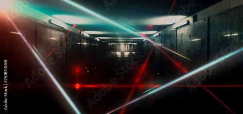 Dark room, a tunnel, a corridor with rays of light and a red laser beam of red color, smoke, smog, dust. Abstract dark  background with light effect, neon. 