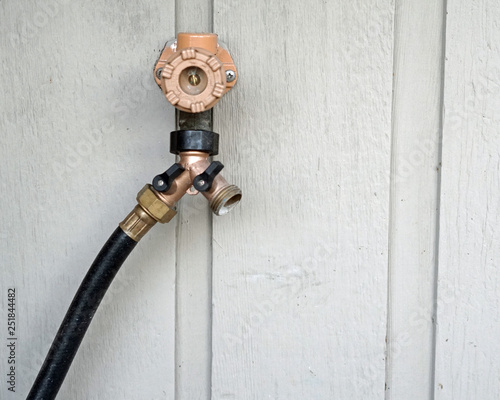 Fotografie Dual Spigot Outdoor Hose Plumbing