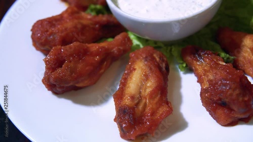 Grilled chicken wings  on a plate. Delicious dish grilled checken wings. German cuisine