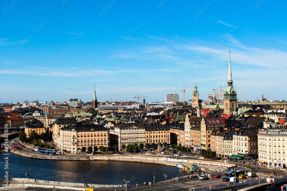 Fototapeta premium View onto Gamla Stan with Tyska kyrkan and typical Stockholm city houses at the waterfront as seen from Södermalm (Stockholm, Sweden, Europe)
