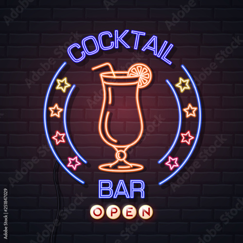 Neon sign cocktail bar on brick wall background. Vintage electric signboard. photo