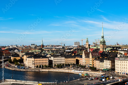 View onto Gamla Stan with Tyska kyrkan and typical Stockholm city houses at the waterfront as seen from Södermalm (Stockholm, Sweden, Europe)