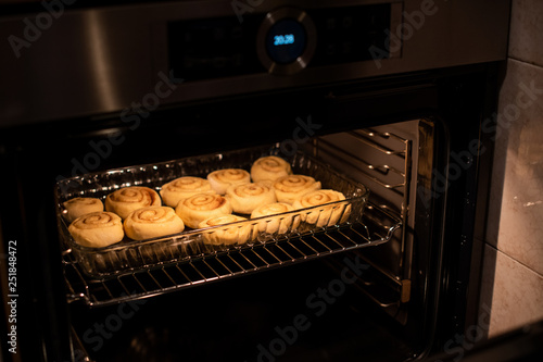 homemade cinnamon rolls, baking in the owen