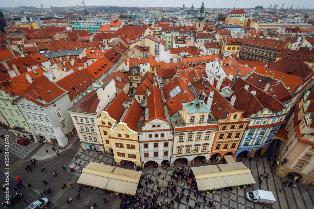 Top view over red roofs and historic center of city Prague, Czech Republic. City panorama. Colorful buildings
