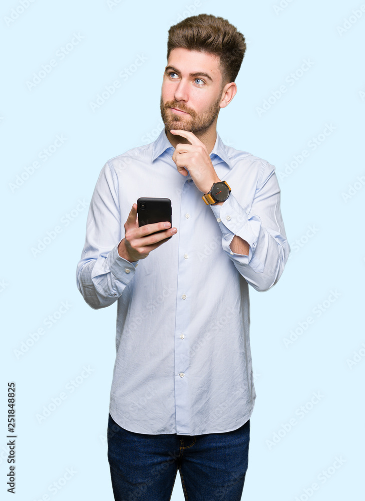 Young handsome man business using smartphone serious face thinking about question, very confused idea Young handsome man business using smartphone serious face thinking about question, very confused idea