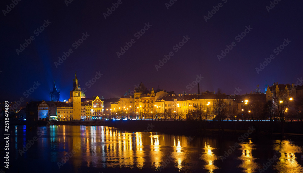 Night view of Vltava river, bridges and the city from the river shore. Night lights. Prague, Czech Republic