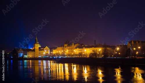 Night view of Vltava river  bridges and the city from the river shore. Night lights. Prague  Czech Republic