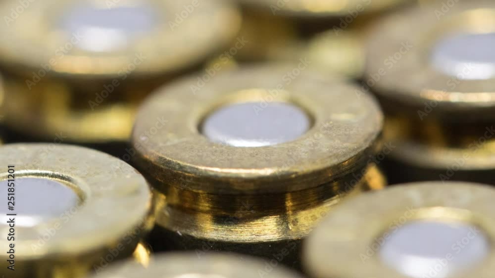 Dolly shot of Rows of 9mm bullet caliber with shallow depth of field Dolly shot of Rows of 9mm bullet caliber with shallow depth of field