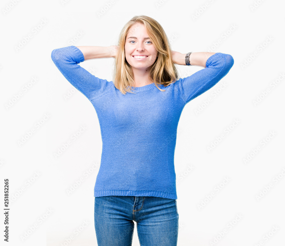 Young woman's stretched skinny arm and fist . Isolated on blue background.  Stock Photo