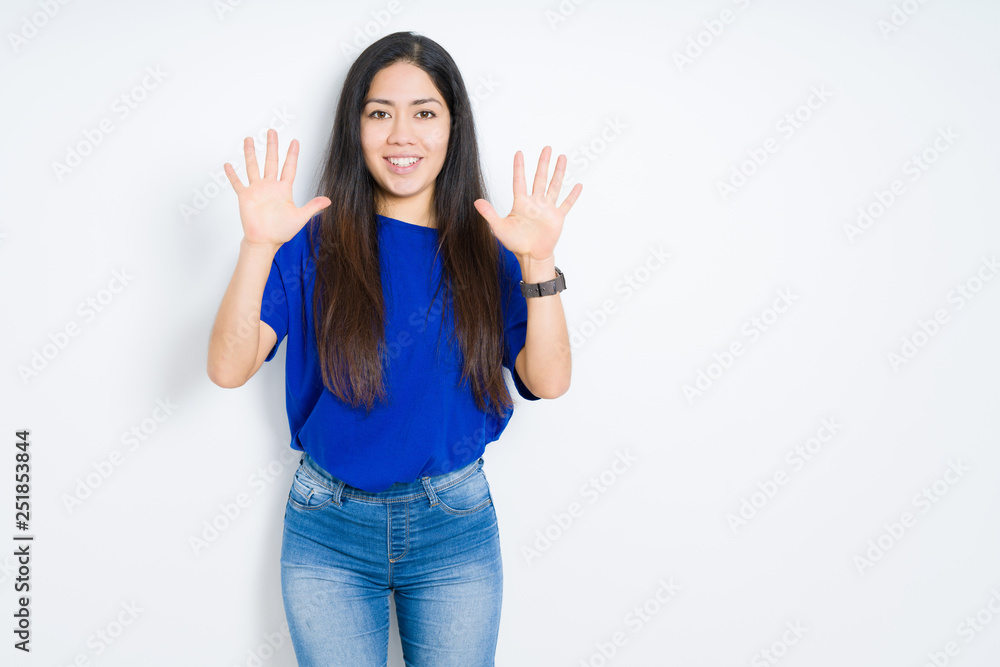 Beautiful brunette woman over isolated background showing and pointing up with fingers number ten while smiling confident and happy. Beautiful brunette woman over isolated background showing and pointing up with fingers number ten while smiling confident and happy.