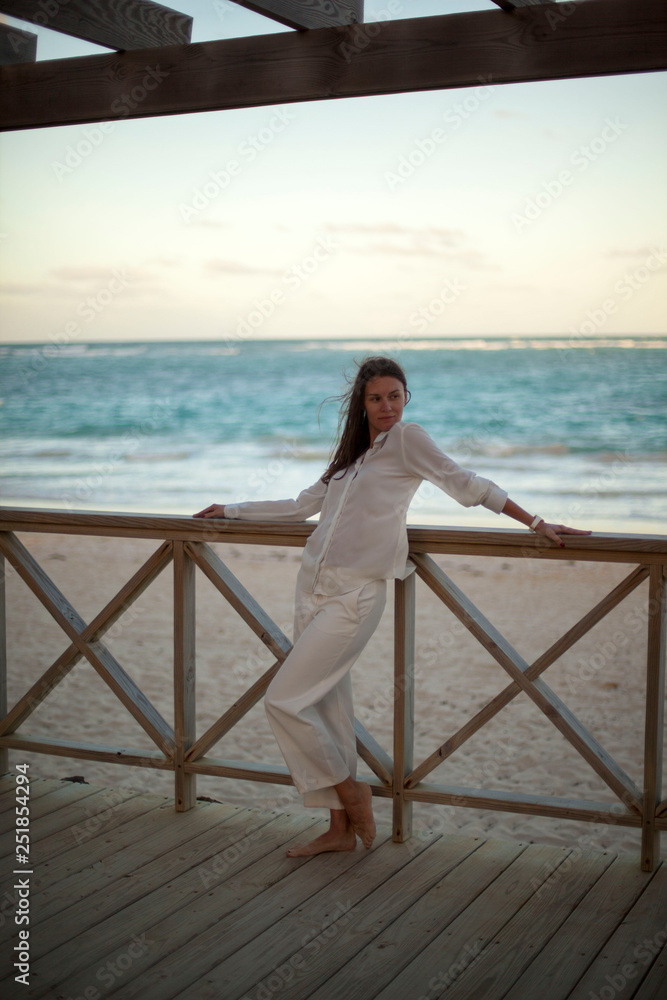 Dreamy girl pose on tropical beach Dreamy girl pose on tropical beach