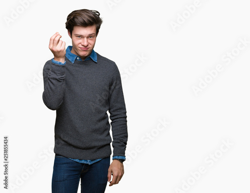 Young handsome elegant man over isolated background Doing Italian gesture with hand and fingers confident expression © Krakenimages.com