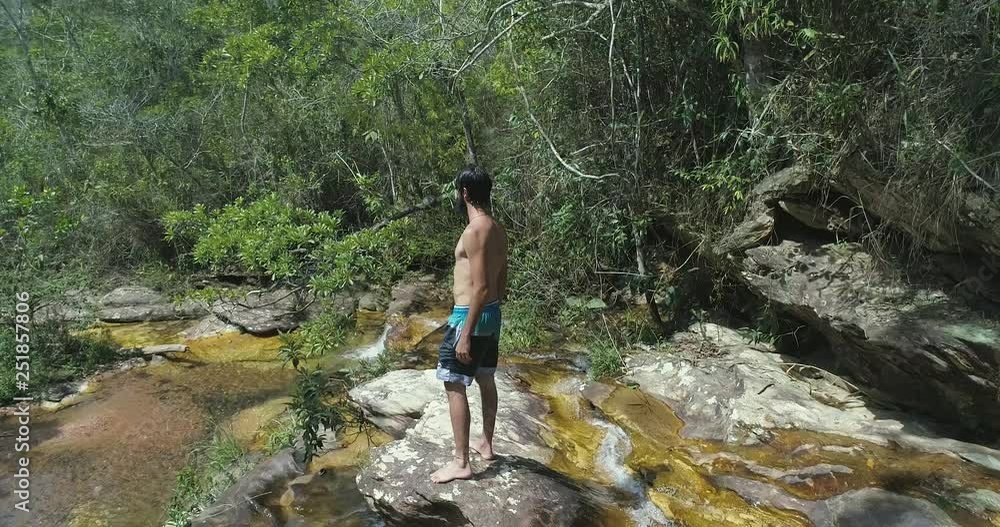 Man exploring nature with backpack and camera Man exploring nature with backpack and camera