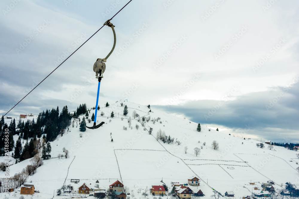 Ski-lift while driving on the highway in the Carpathian resort