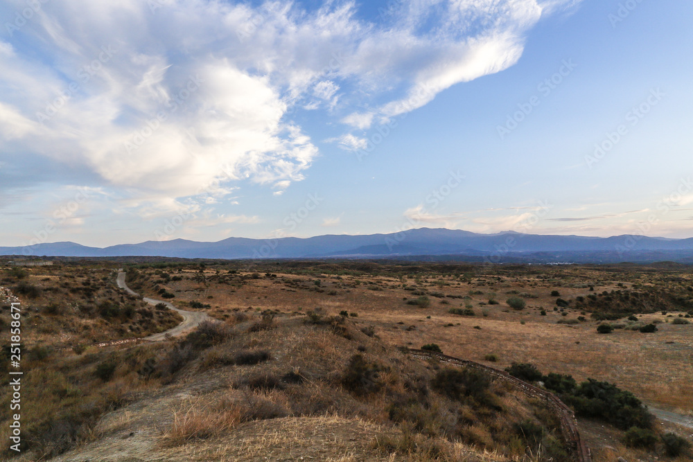 adventure steppe landscape with blue sky and clouds