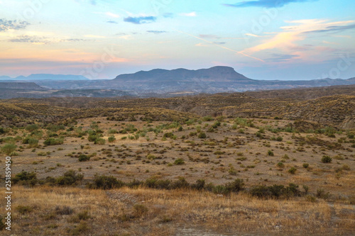 grassland steppe landscape with a big mountain in front of a beautiful sky © Sylvia