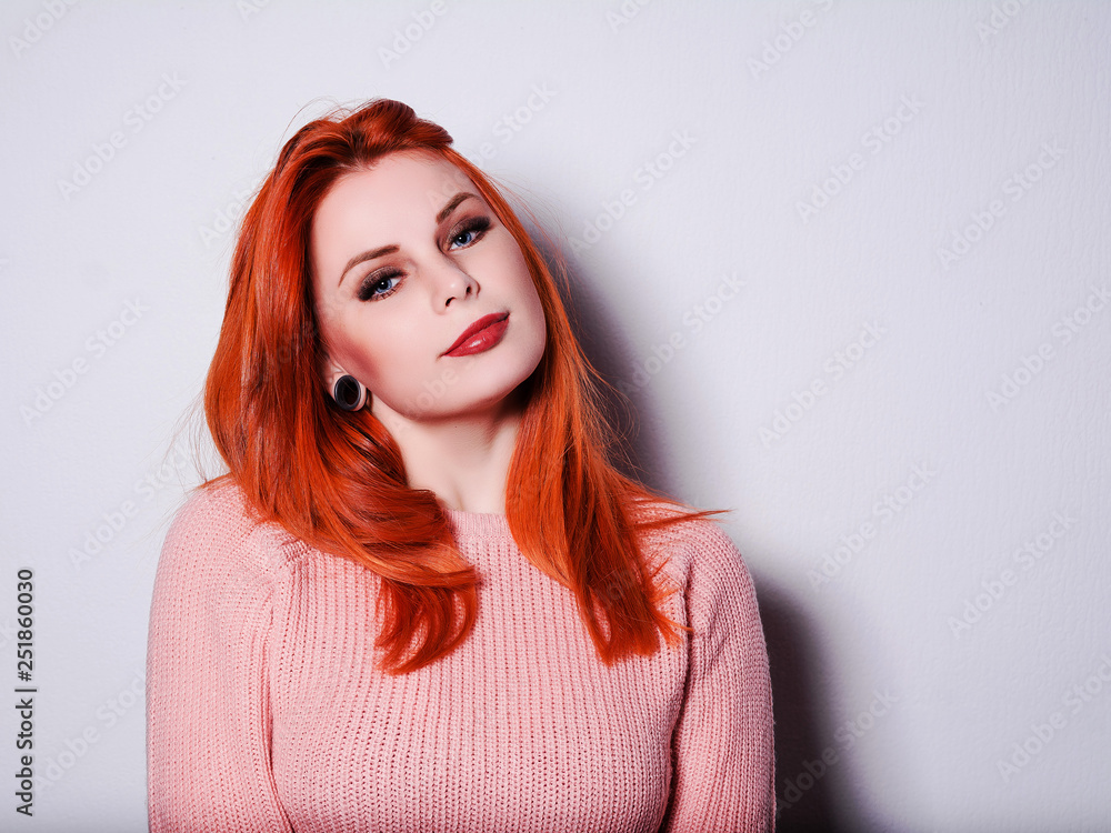 portrait of red-haired girl at the white wall portrait of red-haired girl at the white wall
