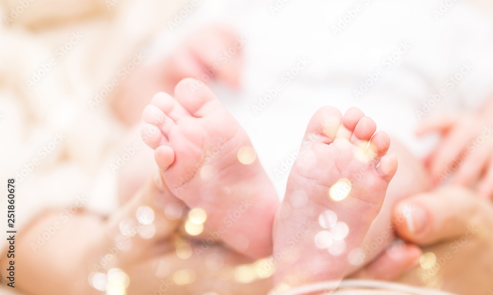Newborn foot mother hand infant child human Newborn foot mother hand infant child human