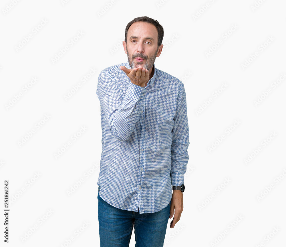 Handsome middle age elegant senior man over isolated background looking at the camera blowing a kiss with hand on air being lovely and sexy. Love expression. Handsome middle age elegant senior man over isolated background looking at the camera blowing a kiss with hand on air being lovely and sexy. Love expression.