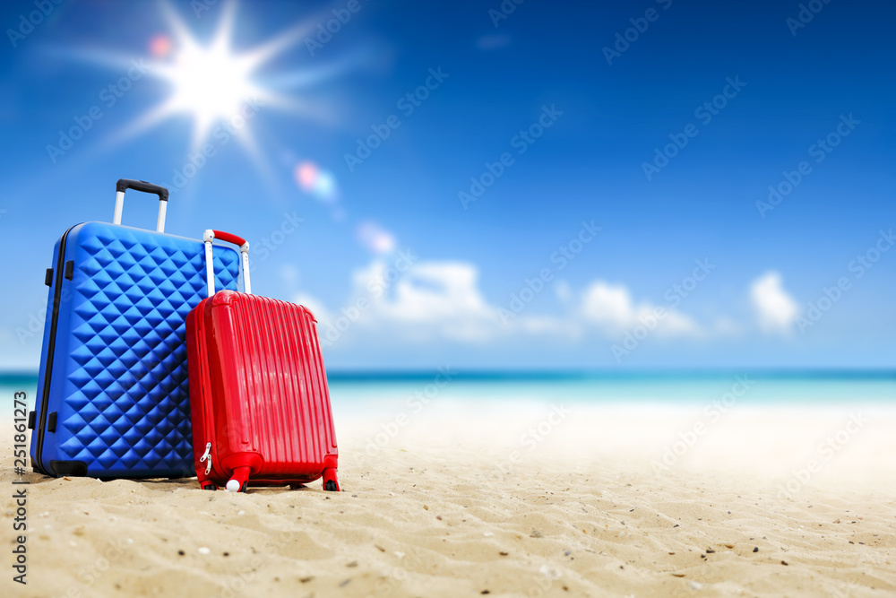 Summer suitcase on beach and sea landscape Summer suitcase on beach and sea landscape