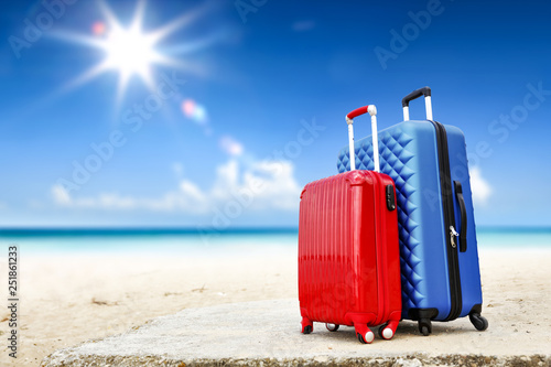 Summer suitcase on beach and sea landscape 