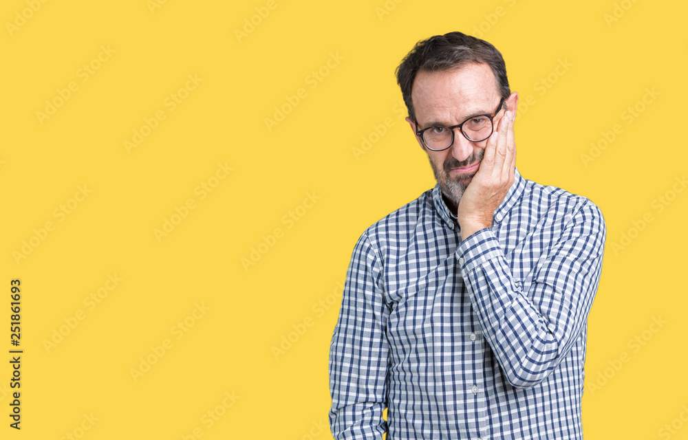 Handsome middle age elegant senior business man wearing glasses over isolated background thinking looking tired and bored with depression problems with crossed arms. Handsome middle age elegant senior business man wearing glasses over isolated background thinking looking tired and bored with depression problems with crossed arms.