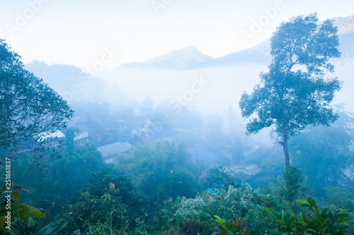 Tranquil view of Bo Kluea salt mining village in the morning mist.