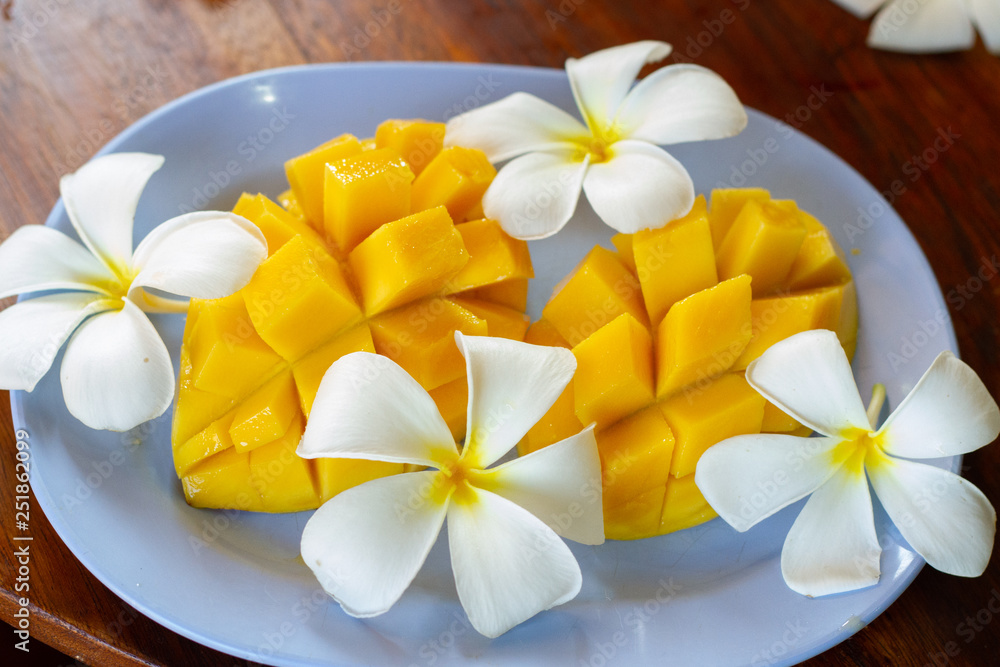sliced beautiful mango and frangipani flowers sliced beautiful mango and frangipani flowers