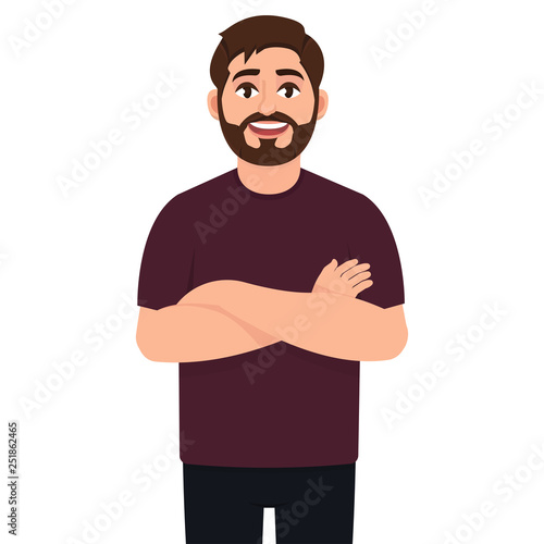 A handsome young man smiles with his arms crossed