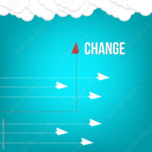 Think differently concept. Red airplane changing direction. New idea, change, trend, courage, creative solution, innovation and unique way concept.