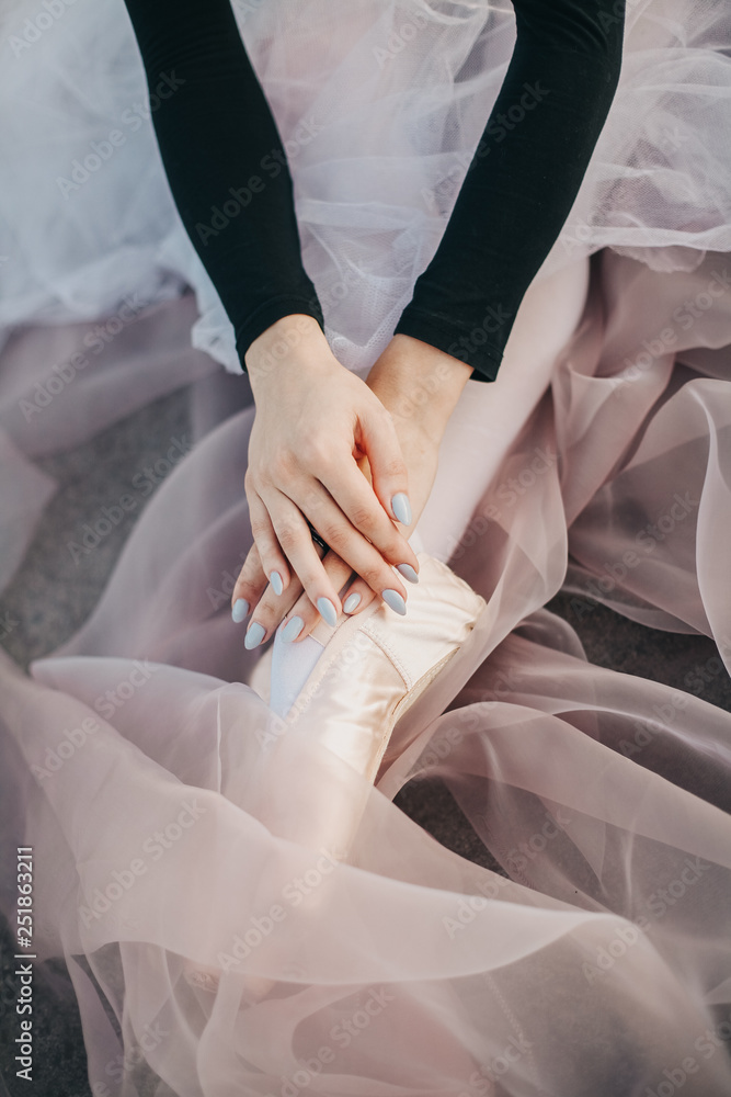 Legs of ballerina in ballet shoes. Classical dance, ballet